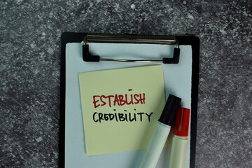 Establish Credibility write on sticky notes on the table. Business concept