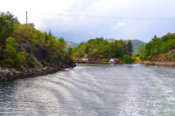 A boat trip in the Lysefjord near Stavanger, Norway. Norwegian fjord, mountains, lonely rustic...