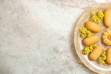 half view of the plate with homemade cookies on the right side of the marble ground