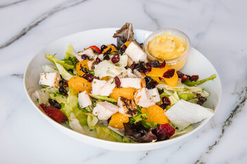 Chicken salad with tangerines berries and lettuce