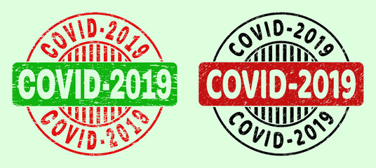 COVID-2019 bicolor round rubber imitations with grunged texture. Flat vector grunge stamps with COVID-2019 text inside round shape, in red, black, green colors. Round bicolor stamps.