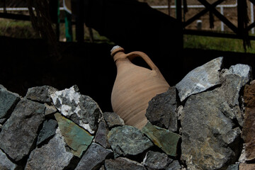 An Armenian jug is placed on the stones