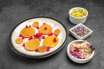 front view yummy pancakes with berries and flowers on grey background fruit dessert sweet
