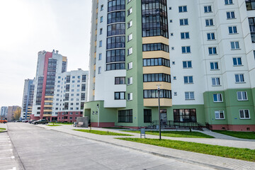 Fototapeta na wymiar view of residential area with multi-storey skyscraper building and and improved courtyard area