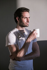 Young single man enjoying his morning coffee
