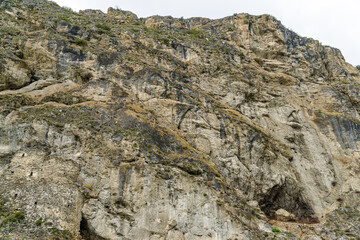 Cloudy view of medieval rock fortress of Dzivgis village in North Osetia Alania, North Caucasus, Russia
