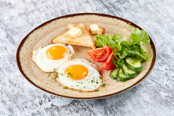 fried eggs with vegetables and toast