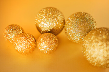 yellow banner for the new year. stylish golden christmas balls toys shiny for christmas tree. space to copy.