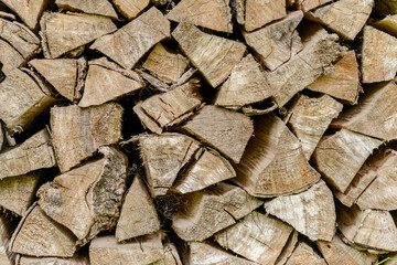 Chopped firewood logs stacked in a pile
