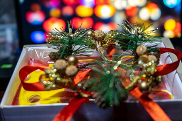 New Year's gift on the background of multi-colored blurred background. christmas present