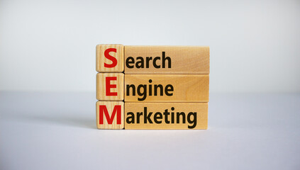 SEM symbol. Concept word 'SEM - search engine marketing' on wooden cubes and blocks on a beautiful white background. Business and search engine marketing - SEM concept. Copy space.