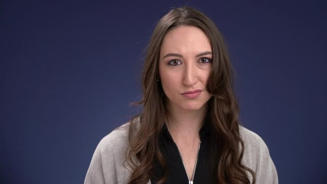 Attractive woman shakes her head no slowly negative expression