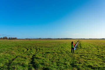 Wanderin stands in a field in Northern Germany