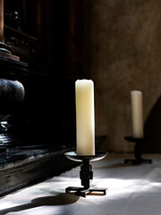 white candles on an altar in a church