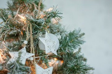 Christmas fir tree, bright decorations. Home atmosphere. Cozy Christmas concept. Selective focus