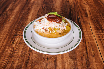 Mexican chicken soup topped with cheese
