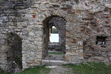 Fototapeta na wymiar Ruins of the ancient Kokne castle on the territory of Latvia on the river bank 23 October 2020