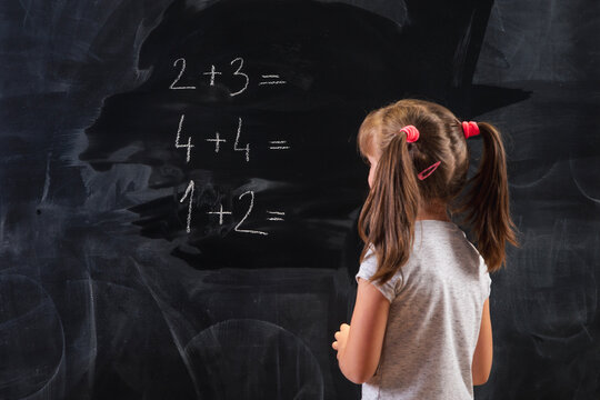 Schoolgirl solving math problems