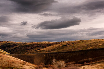 Eastern Oregon high desert rolling hills under cloudy skies