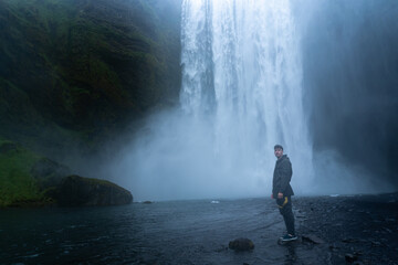 Obraz premium photo of happy tourist friends at the Skógafoss waterfall in Iceland