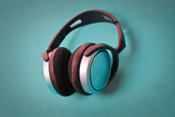 bluetooth headphones on a turquoise background