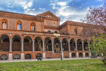 Fototapeta premium The exterior of the University of Milan. University of Milan is based in famous La Ca Granda - huge Ospedale Maggiore complex. Milan, Lombardy, Italy.