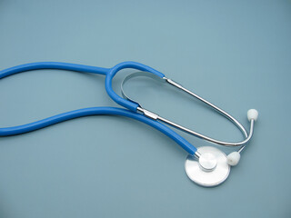 blue stethoscope with one-way head for blood pressure measurement on a blue background