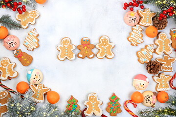 Christmas new year food, traditional festive gingerbread and tangerines with fir branches, pine cones and decorations, dish design idea, background, bakery concept,selective focus,