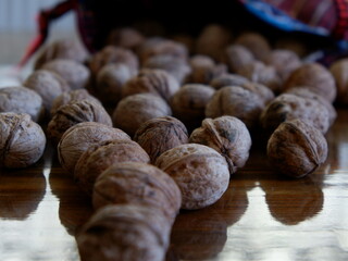 Quality walnuts are inside the bag. Walnuts in the Ethnic patterned bag,food 