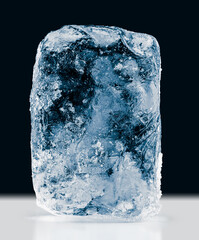 Textured natural ice block, isolated on black background. Clipping path included.