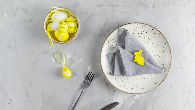 Ultimate Gray and Illuminating aesthetic elegant fine Easter events table place setting overhead. Top view creative composition flat lay. Stop motion animation.