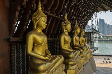 Buddha golden statues in Seema Malaka temple, Colombo city, Sri Lanka