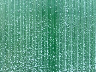 Frost on the green metal fence - Powered by Adobe