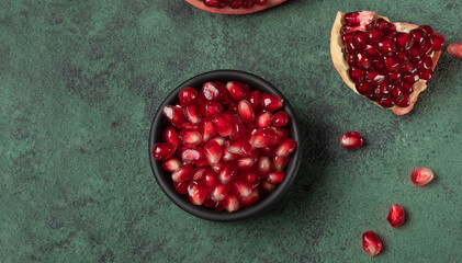 Top view of ripe pomegranate seeds. Food background