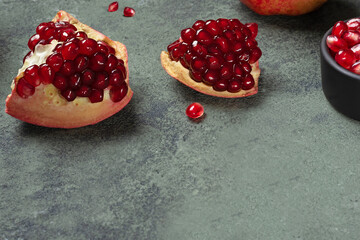 pieces and seeds of ripe pomegranate on the table. Healthy fruit