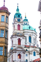 Fototapeta premium Towers of the St Nicholas Church in Lesser Town of Prague, Czech republic