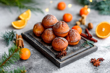Fototapeta na wymiar Beautiful delicious fresh cocoa muffins on the Christmas table