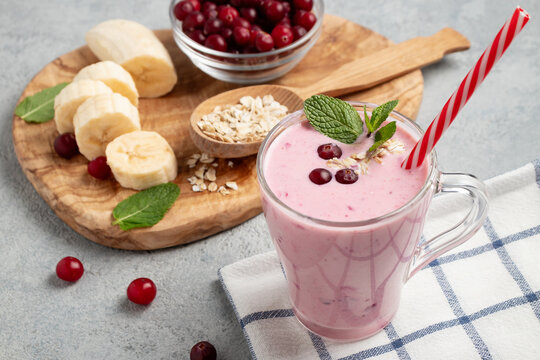 Homemade yogurt smoothie with banana, cranberry and oatmeal