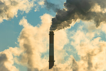 Smoking factory chimneys. Environmental problem of pollution of environment and air in large cities