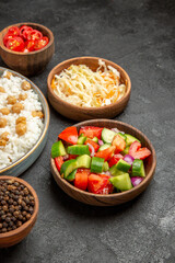 Peas and rice meal for dinner with sauerkraut salad pepper on dark background