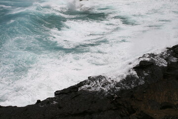 waves crashing on rocks