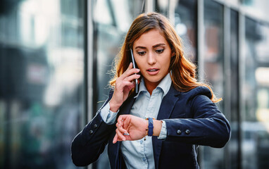 Something going wrong. Businesswoman on the way to office looking at watch while waiting money...