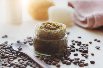 spa cosmetic products, milk soap, handmade sugar coffee scrub with coconut oil in glass jar and...