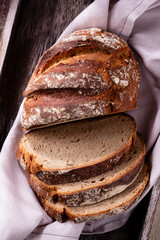 Sliced rye bread on cutting board, closeup..