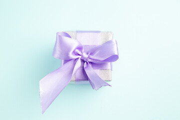 top view cute little present tied with bow on blue background gift photo xmas new year color