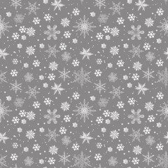Beautiful seamless pattern for Merry Christmas and New Year. Gray background with white snowflakes. Christmas and New Year background. 