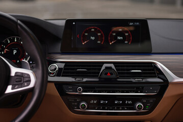 Multimedia, climat control buttons. Interior car detail.