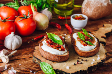 Two Bruschetta with Dried Tomatoes and Spicy Sauce