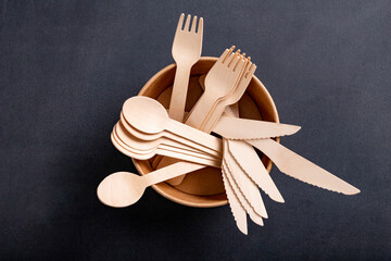 Wooden cutlery on the table. Utensils used in the fast food bar.
