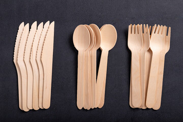 Wooden cutlery on the table. Utensils used in the fast food bar.